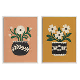 Two framed canvas artworks featuring stylized white flowers with green stems in black pots with white tribal patterns, set against terracotta and mustard yellow backgrounds.
