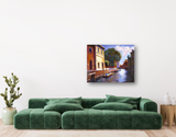 Canvas print of a Venice canal scene featuring warm-toned buildings, a large green tree, and blue sky reflections over the waterway.