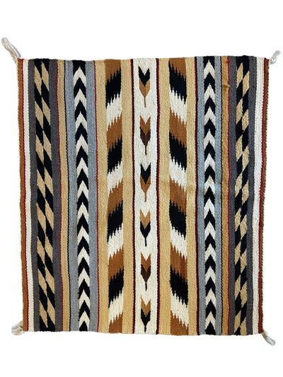 Vintage Native American Navajo Rug measuring 29 by 32 inches with traditional geometric patterns