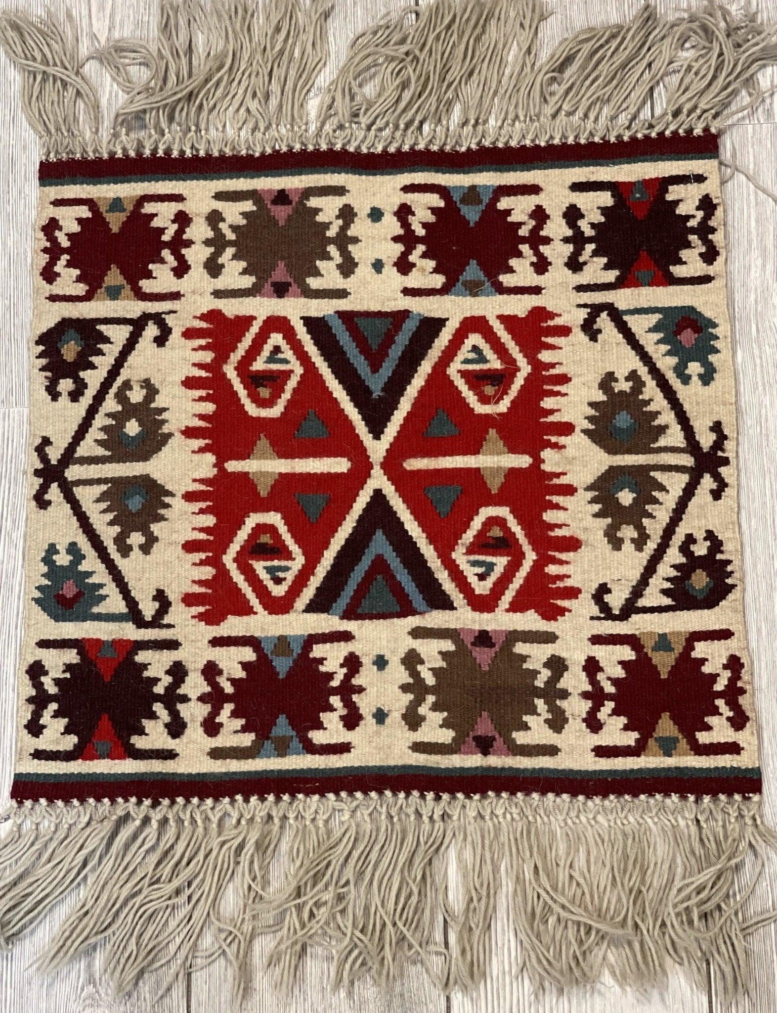 Vintage Navajo Like Bulgarian Wool Kilim Display Rug laid on wooden floor