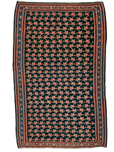 Vintage Persian Senneh Kilim rug with dark navy background featuring a repeating rust-orange floral motif and multiple geometric patterned borders in orange and blue.