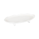 White oval tray with an irregular scalloped edge and three short conical legs, shown on a white background.