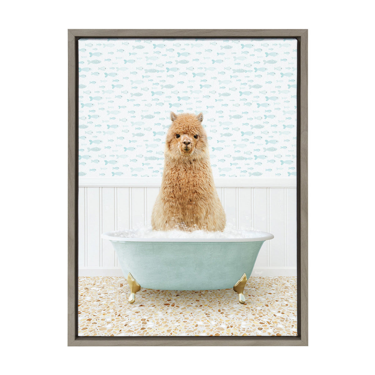 Brown alpaca standing in a light blue clawfoot bathtub filled with bubbles, against a wall with white paneling and blue fish-patterned wallpaper.