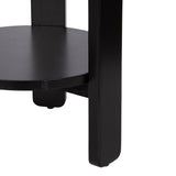 Close-up of black round wooden shelf supported by thick vertical legs with smooth, straight edges