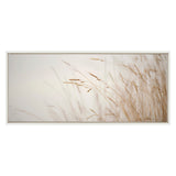Framed canvas depicting delicate golden marsh grass gently bending against a soft, pale background in a minimalistic horizontal composition.