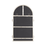 Rectangular metal-framed mirror with an arched top and black backing secured by horizontal metal bars with visible rivets and two metal loops near the top.