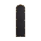 Back view of a traditional arched mirror with a black backing and a gold frame featuring ornate decorative elements at the top and securing clips along the edges.