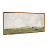 Wide horizontal landscape painting depicting a green field under a cloudy, pale sky, framed in light brown wood with a beaded edge.