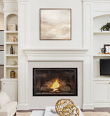 Square framed abstract painting with white and beige tones above a lit modern fireplace in a white built-in wall with shelves and a decorative gold geometric sculpture on the mantle.