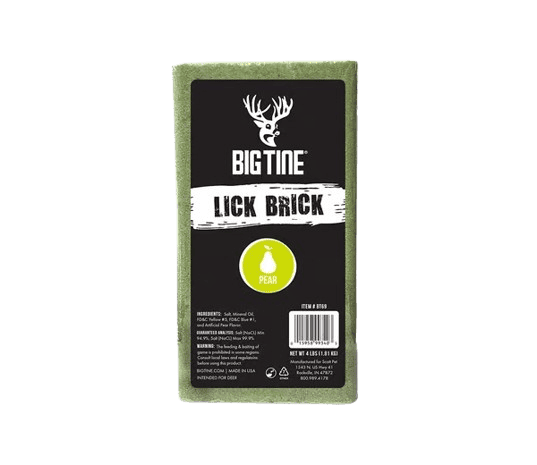 Rectangular green Big Tine Lick Brick with black label featuring a white deer logo, product name, and a yellow pear icon in the center.