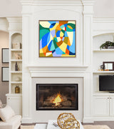 Abstract painting above fireplace with overlapping curved shapes in blue, green, yellow, orange, and white, framed and set in a white living room interior.