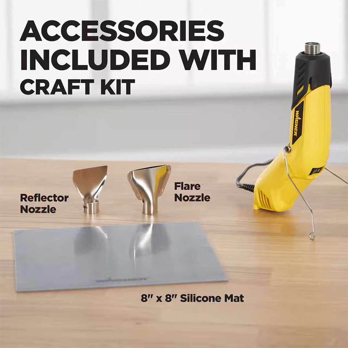 Yellow Wagner FURNO micro heat gun with black accents standing on a wooden surface, accompanied by two metal nozzles labeled reflector and flare, and an 8x8 inch gray silicone mat.