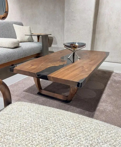 Handcrafted resin coffee table with smoke-colored resin river and solid walnut legs