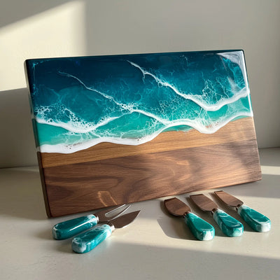 Handcrafted walnut charcuterie board with ocean resin waves and four matching walnut-handled cheese knives