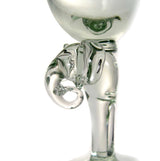 Clear glass wine glass with a stem shaped like an elephant's head and trunk curling outward in clear glass detail.
