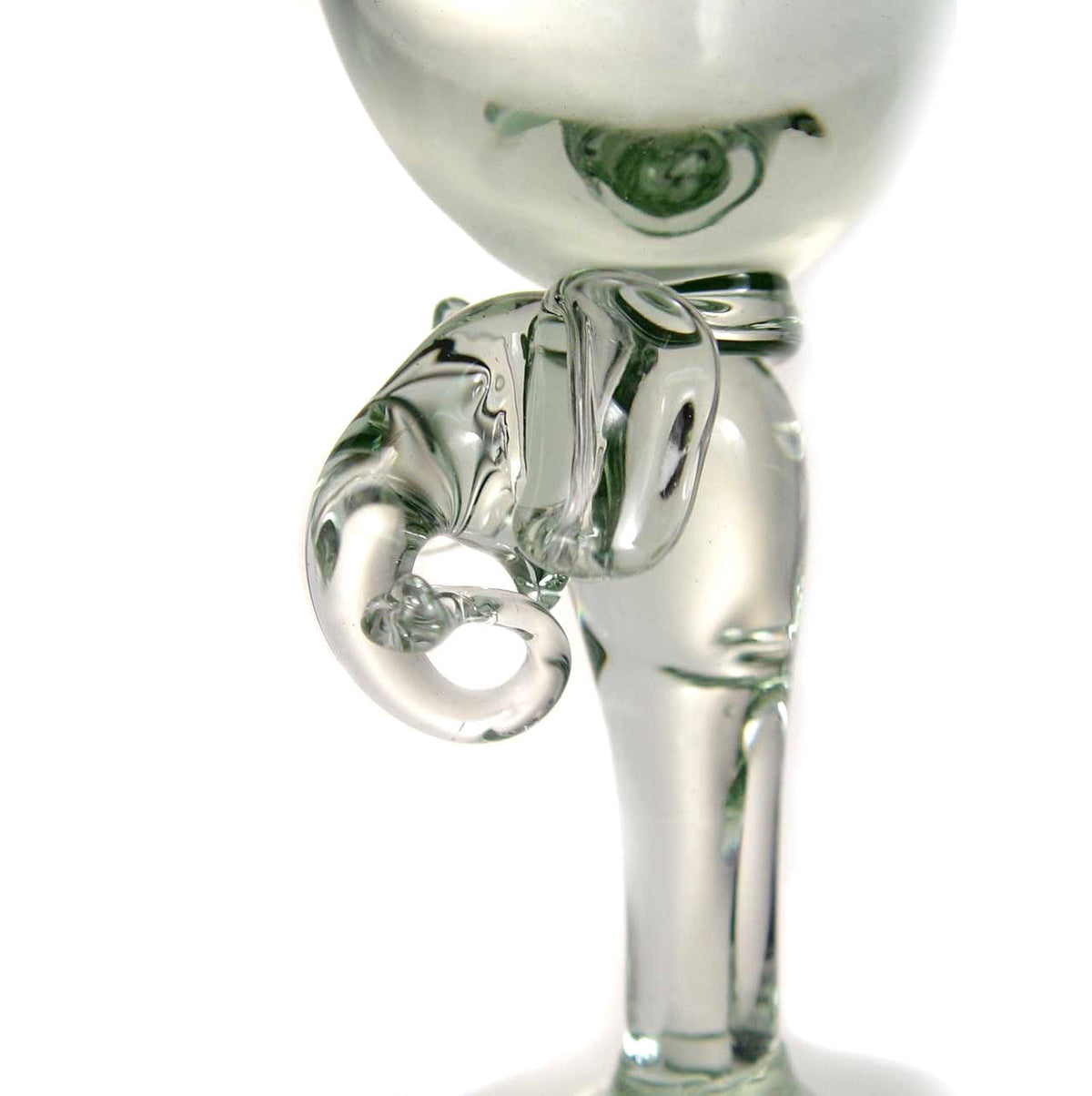 Clear glass wine glass with a stem shaped like an elephant's head and trunk curling outward in clear glass detail.