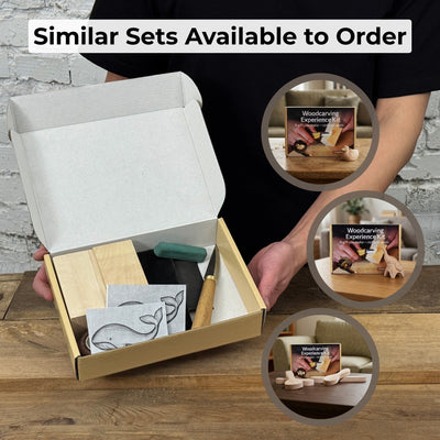 Whale Carving Kit with knife, wooden blocks, sandpaper, sharpening board, pencil, and whale drawing template