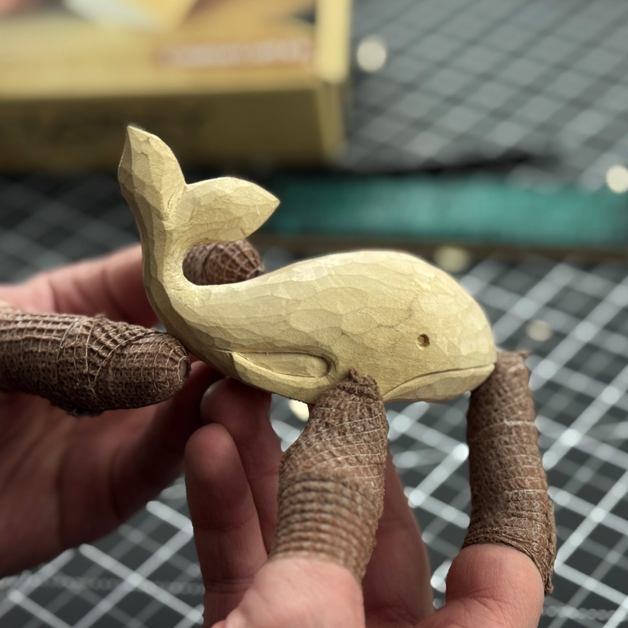 Whale Carving Kit with knife, wooden blocks, sandpaper, sharpening board, pencil, and whale drawing template