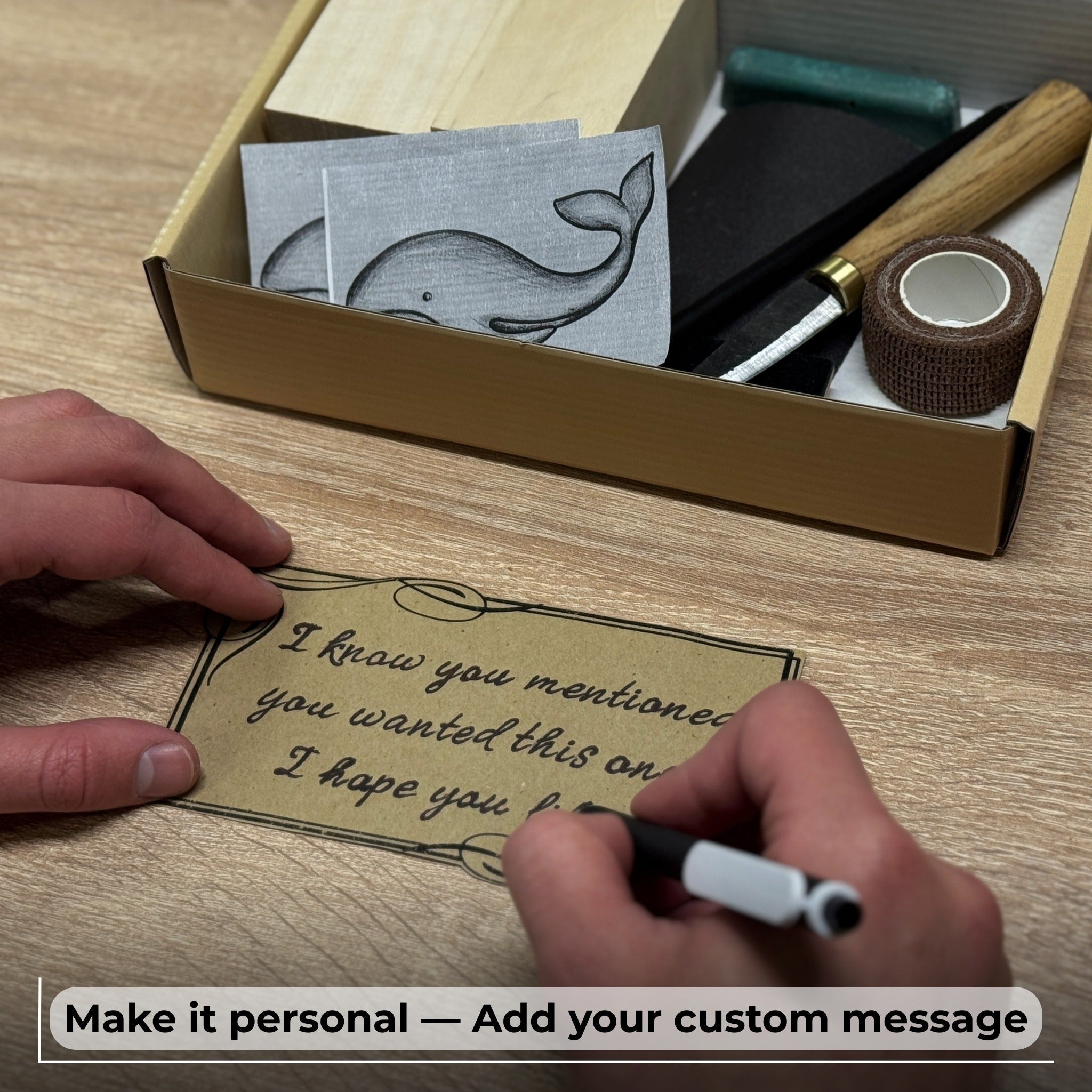 Whale Carving Kit with knife, wooden blocks, sandpaper, sharpening board, pencil, and whale drawing template