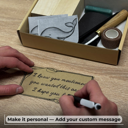 Whale Carving Kit with knife, wooden blocks, sandpaper, sharpening board, pencil, and whale drawing template