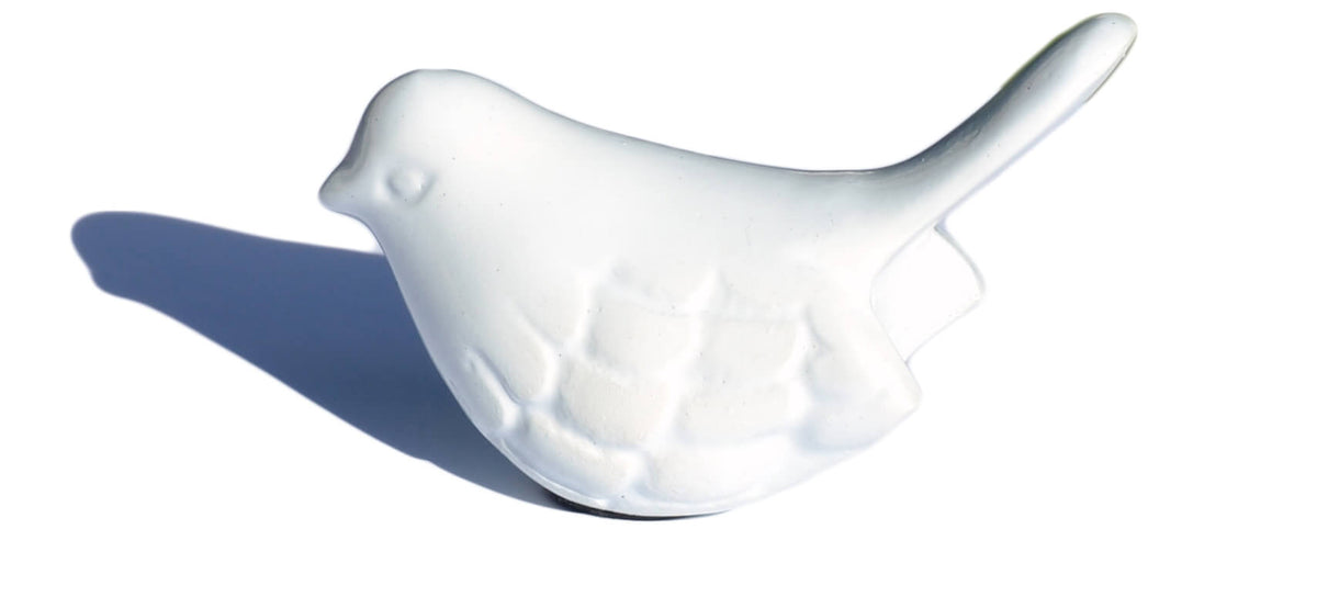 White aluminum bird figurine from Vibhsa on white background