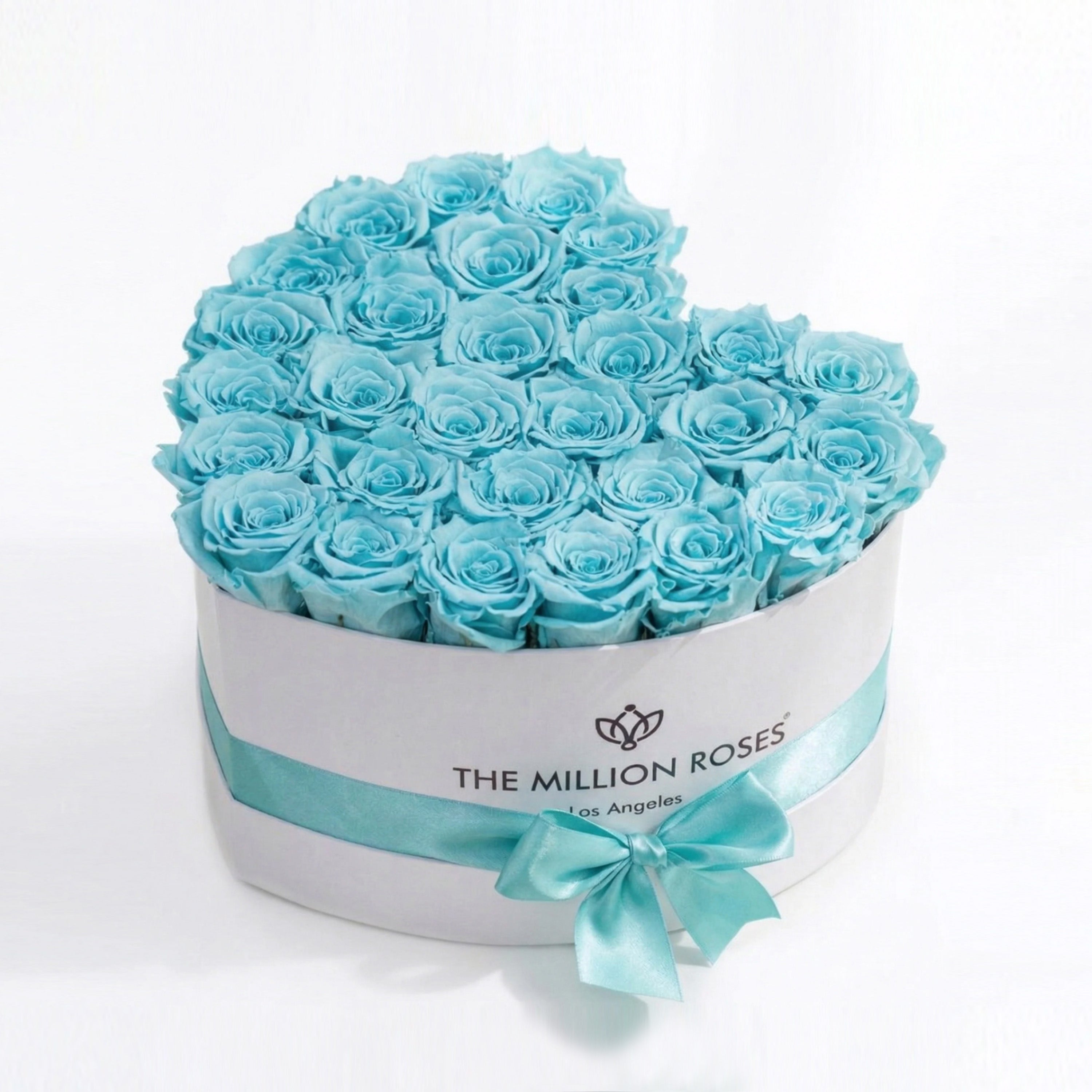 Heart-shaped white box filled with 28-30 hand-formed turquoise blue roses