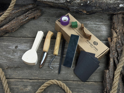 Beginner wood carving kit with sloyd knife, hook knife, wooden blank, sandpaper, sharpening board, pencil, and finger wrap