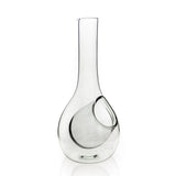 Clear glass wine decanter with a tall narrow neck and a unique angled pouring spout integrated into its bulbous base.