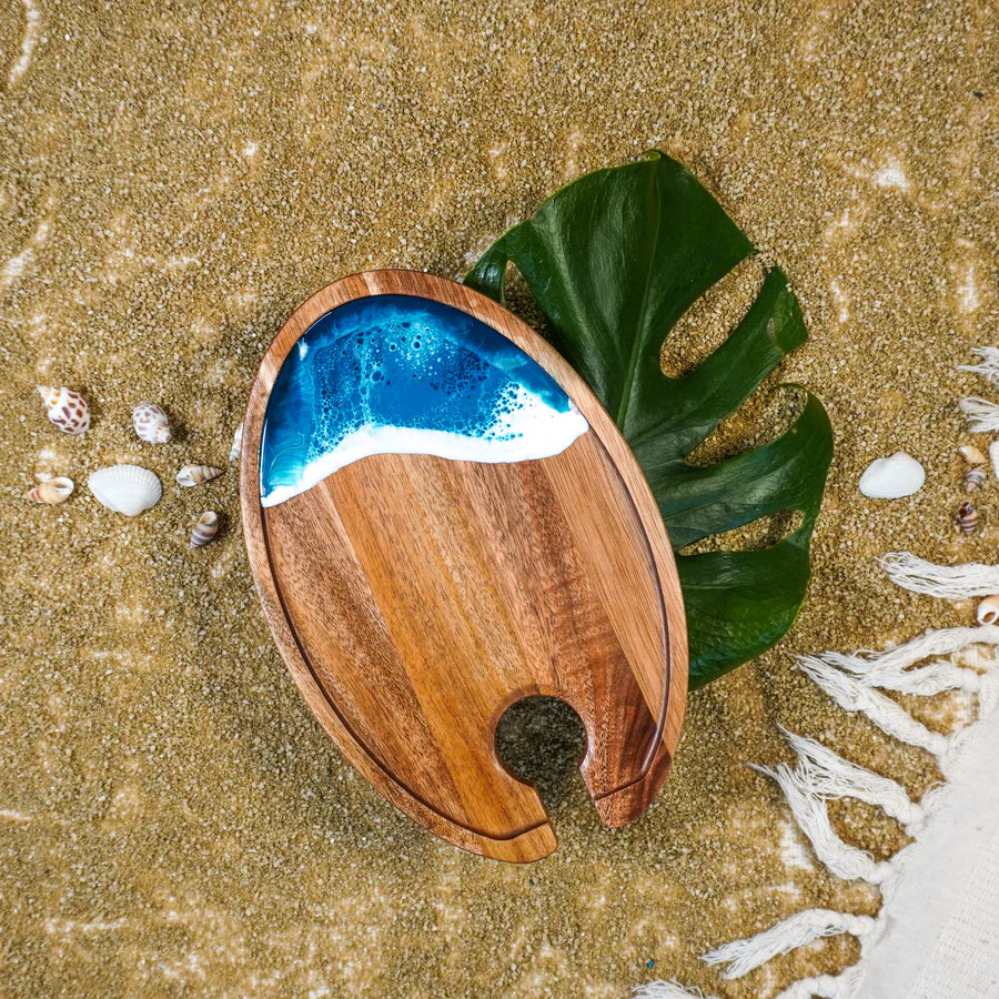 Wine & Appetizer Tray with blue resin on a sandy background with a leaf and shells.