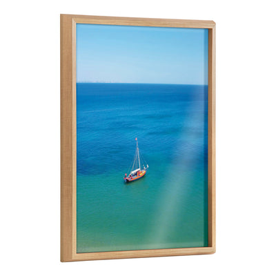 Framed printed art titled 'Blake A Lagos Sail' by Rachel Bolgov, showing a coastal scene with sailboats.