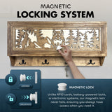 Wooden wall-mounted gun storage box with a wolf and forest scene carved on the front panel, featuring a white magnetic lock knob and four black metal hooks below.