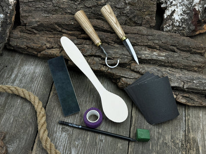 Wood Whittling Starter Kit with sloyd knife, hook knife, wooden blank, sandpaper, sharpening board, pencil, and finger wrap