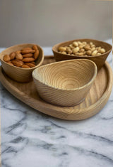 Set of handcrafted wooden nut bowls with tray showing natural wood grain and sandblasted texture