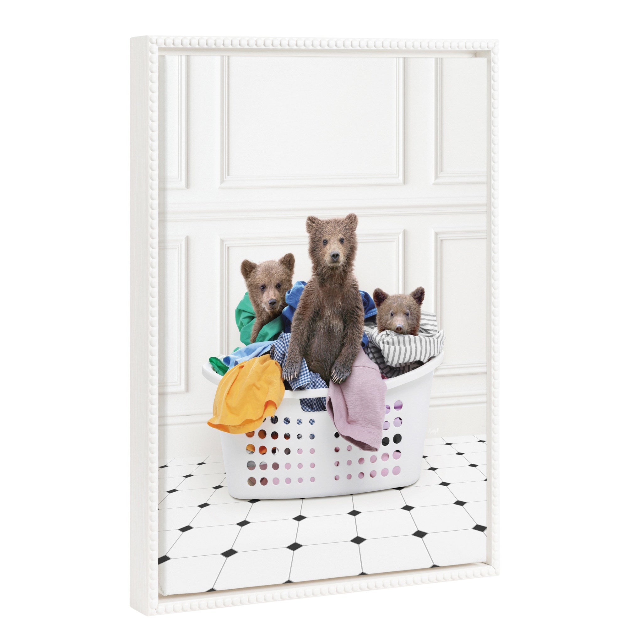 Framed canvas art showing three baby bear cubs inside a white laundry basket with a vintage beaded frame