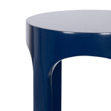 Close-up of a Dahl Wood Drink Table painted in glossy deep navy blue with smooth rounded edges and a curved leg detail.