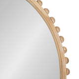 Close-up of the upper corner of an arched wooden wall mirror frame featuring round wooden pegs evenly spaced along the outer edge, against a plain gray background.