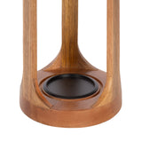 Close-up of a wooden candle holder base featuring four vertical supports and a round black candle plate in the center, with smooth natural wood grain visible.
