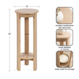 Tall round wooden side table with a small 12-inch tabletop and a 9-inch lower shelf, featuring a light natural finish and open vertical panel legs.