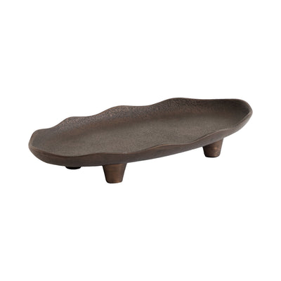Alessia Oval Decorative Tray in bronze color with rough-hewn texture and deckled edges, resting on a wooden table