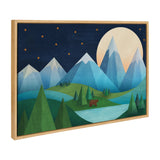 Framed canvas art showing a moonlit mountain scene with a bear near a lake