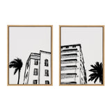 Two framed canvas artworks featuring Miami Beach retro Art Deco architecture in white and bright gold frames