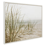 Framed canvas of tall, slender beach grass growing on pale sandy dunes with a hazy ocean horizon in soft muted tones.