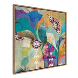 Sylvie Abstract Flower Love framed canvas art showing colorful abstract flowers with a gold frame hanging on a wall.