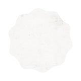 Top view of a scalloped white marble table top with subtle grey veining and an irregular wavy edge.