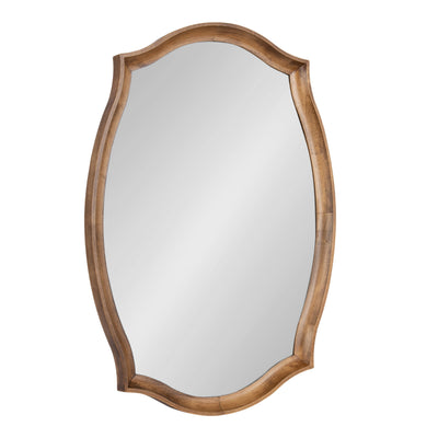 Hatherleigh Scallop Wall Mirror with scalloped oval shape and rustic brown wooden frame hanging on wall