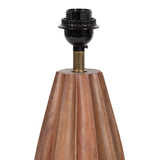 Geometric wooden table lamp base with vertical scalloped panels and a black socket fitting on top, supported by a brass connector.