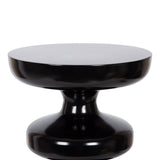 Glossy black metal side table with a round top and a sculpted pedestal base featuring two bulbous shapes connected smoothly.