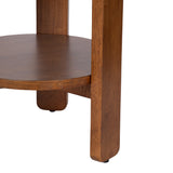 Close-up of a round wooden side table's lower shelf and legs with a smooth, warm brown finish and simple, straight leg design.