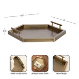 Hexagonal metal tray with antique brass finish, featuring two tubular handles and a raised edge, measuring 18 by 15.5 inches and 2.5 inches deep.
