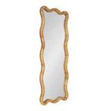 Tall rectangular mirror with a scalloped edge frame made of woven light brown rattan, featuring continuous wavy contours around the glass surface.